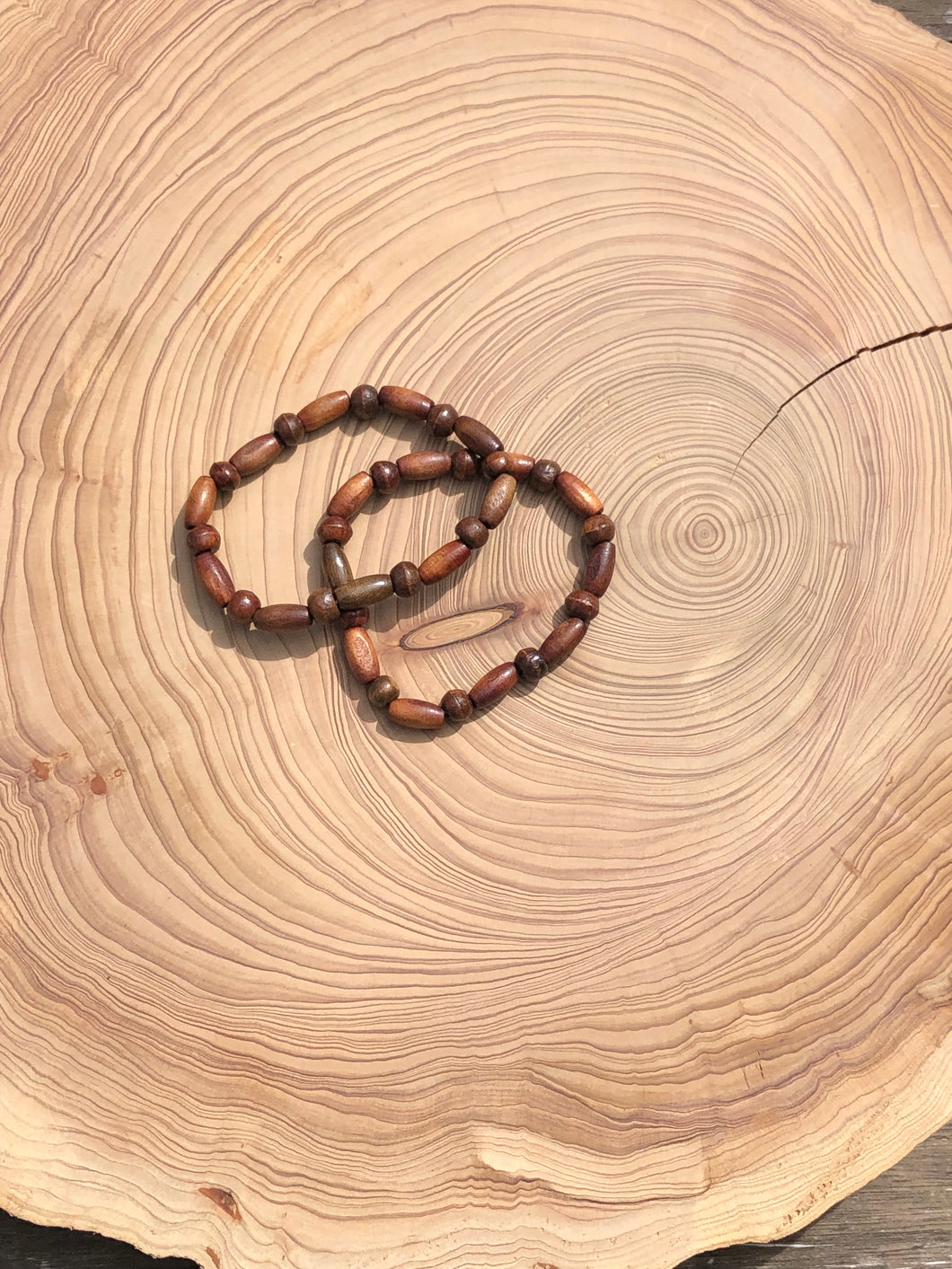 Handmade beaded bracelet on elastic. Made out of brown recycled beads.