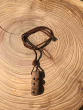 Load image into Gallery viewer, Hand made boho style necklace with hand carved pendant and vintage beads. On faux suede cord with metal fastening
