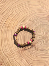 Load image into Gallery viewer, Handmade beaded bracelet on elastic. Made out hot pink, purple, brown and beige recycled beads.
