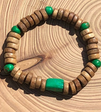 Load image into Gallery viewer, Handmade beaded bracelet on elastic. Made out of emerald green and brown recycled beads.
