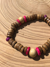 Load image into Gallery viewer, Handmade beaded bracelet on elastic. Made out hot pink, purple, brown and beige recycled beads.
