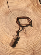 Load image into Gallery viewer, Hand made boho style necklace with hand carved pendant and vintage beads. On faux suede cord with metal fastening
