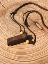 Load image into Gallery viewer, Hand made boho style necklace with hand carved pendant and vintage beads. On faux suede cord with adjustable fastening
