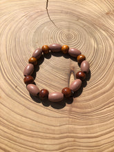 Load image into Gallery viewer, Handmade beaded bracelet on elastic. Made out dusty pink, brown and beige recycled beads.
