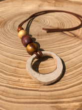 Load image into Gallery viewer, Hand made boho style necklace with hand carved pendant and vintage beads. On faux suede cord with tie fastening
