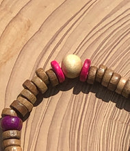 Load image into Gallery viewer, Handmade beaded bracelet on elastic. Made out hot pink, purple, brown and beige recycled beads.
