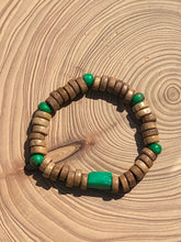 Load image into Gallery viewer, Handmade beaded bracelet on elastic. Made out of emerald green and brown recycled beads.
