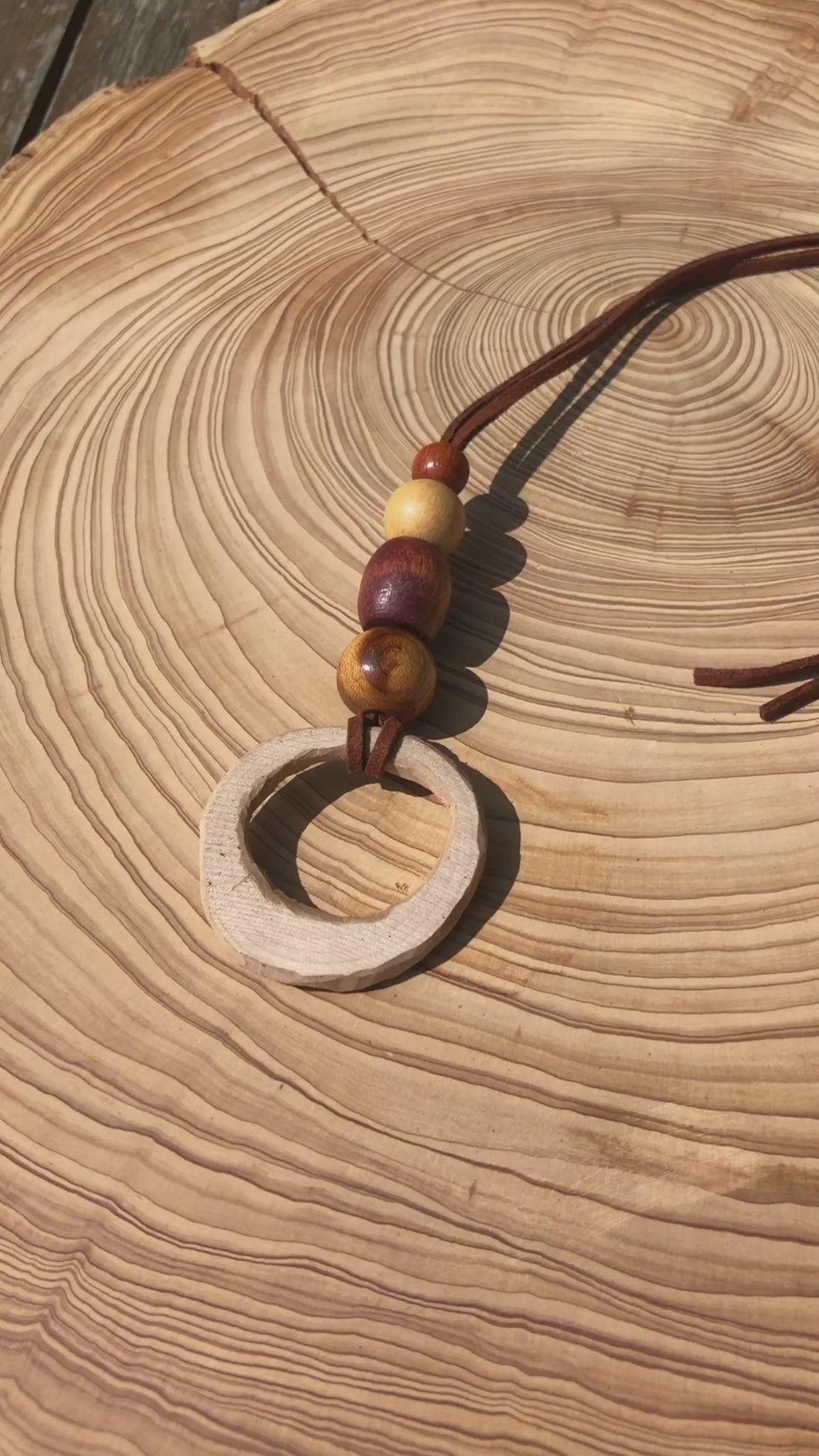 Hand made boho style necklace with hand carved pendant and vintage beads. On faux suede cord with tie fastening