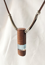 Load image into Gallery viewer, Pendant necklace handmade out of reclaimed hard wood and resin. On adjustable suede cord.
